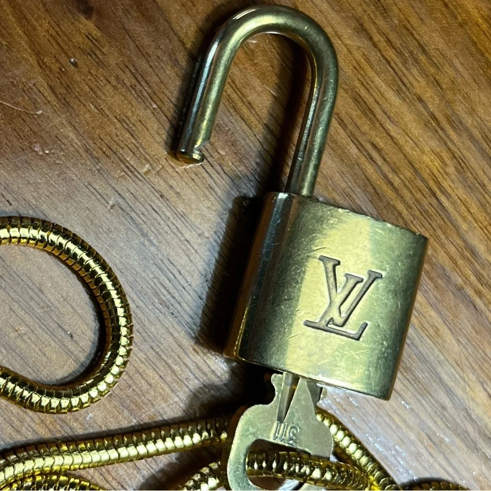 Louis Vuitton Gold Lock On off brand chain No 316 Works. Authentic